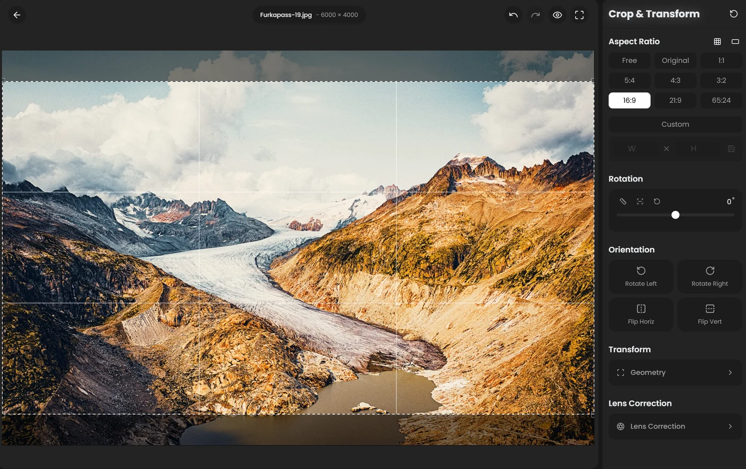 Crop and Transform panel showing aspect ratio presets, rotation slider, orientation buttons, and the Geometry and Lens Correction sections