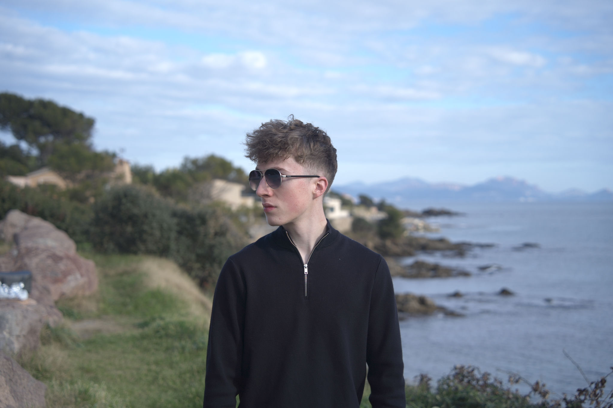 Original portrait: flat lighting, slightly cool, busy background